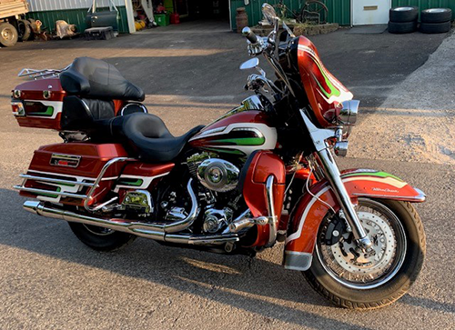 Motorcycle with custom paint job - red with green and yellow accents